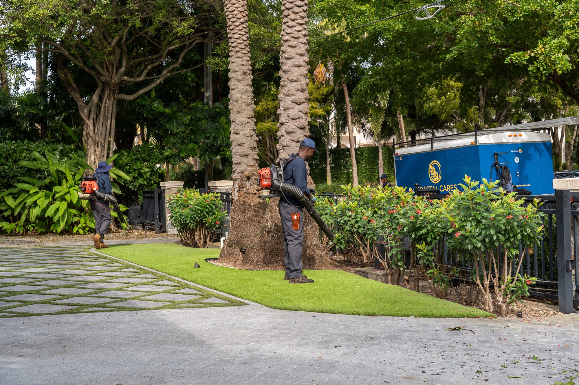Coastal Cares crew detailing an estate driveway and hedges