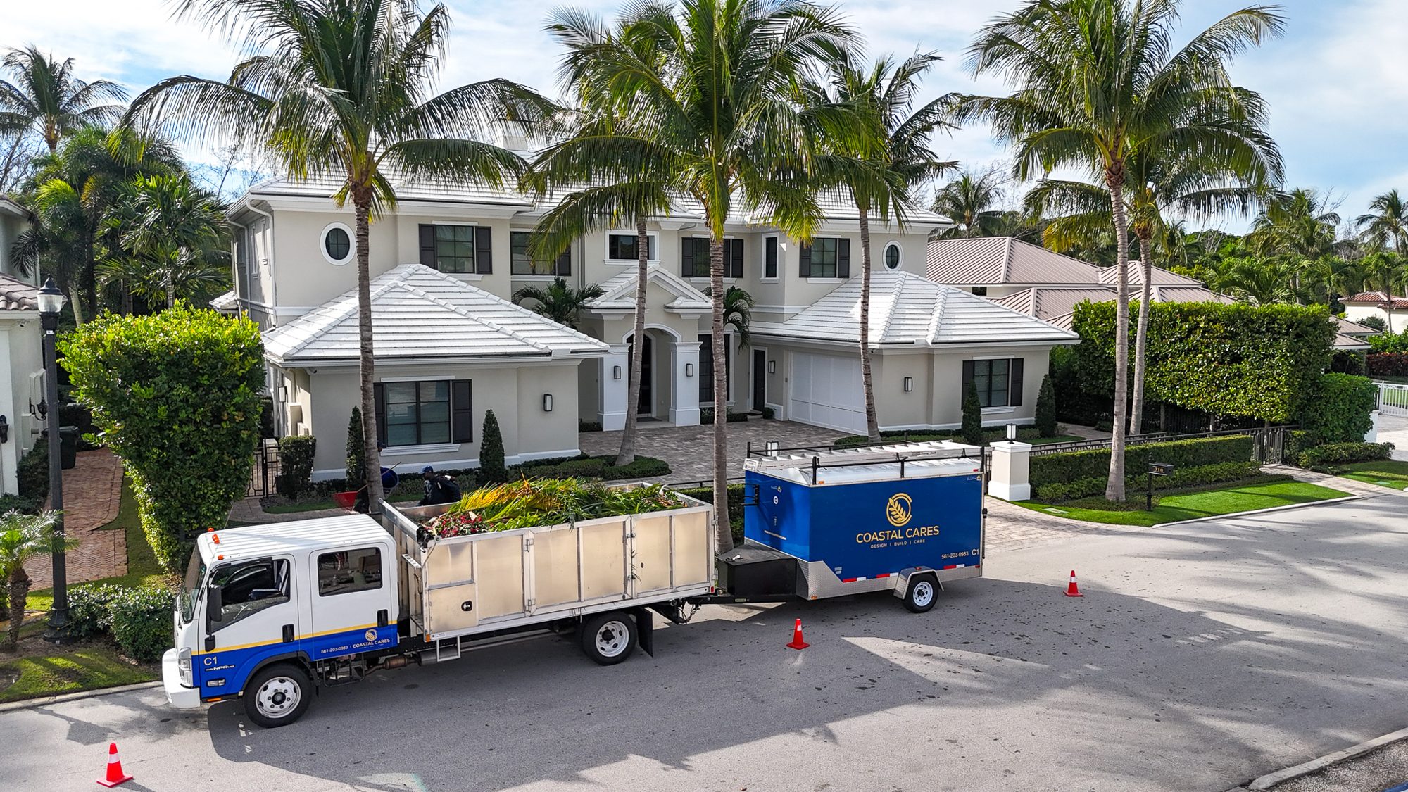 Coastal Cares service fleet on site at a waterfront estate